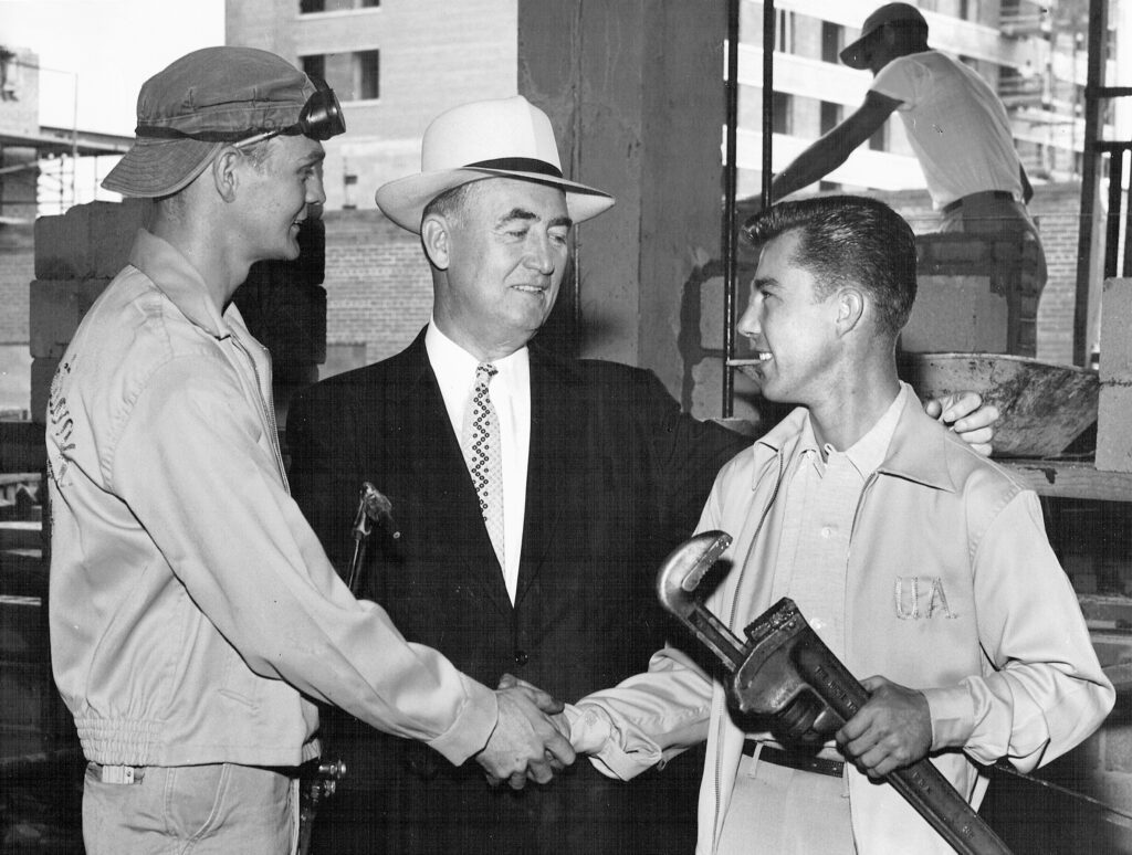 MCAMW early members shaking hands